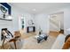 Bright living room showcasing an open layout, hardwood floors, and easy access to other rooms at 1333 N Lafayette St, Denver, CO 80218