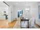Bright office space with hardwood floors, neutral colors and a view of the kitchen at 1333 N Lafayette St, Denver, CO 80218