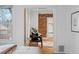 View from bedroom into sitting area featuring exposed brick at 1333 N Lafayette St, Denver, CO 80218