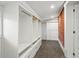 Spacious walk-in closet with custom shelving and drawers with exposed brick at 1333 N Lafayette St, Denver, CO 80218