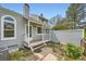 Backyard with a small patio and steps, surrounded by landscaping, creating a private retreat at 494 Owl Dr # 4, Louisville, CO 80027