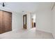 Well-lit, neutral bedroom with a closet and an open door to a bathroom, providing convenience at 494 Owl Dr # 4, Louisville, CO 80027