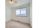 Simple bedroom with neutral carpet and a large window at 494 Owl Dr # 4, Louisville, CO 80027