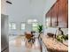 Bright dining area with glass table, modern lighting, and views of the outdoors at 494 Owl Dr # 4, Louisville, CO 80027
