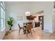 Bright dining area featuring a glass table, stylish chairs, and adjacent kitchen at 494 Owl Dr # 4, Louisville, CO 80027