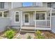 Inviting front entrance with covered porch and well-maintained landscaping at 494 Owl Dr # 4, Louisville, CO 80027