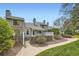 Townhome featuring a fenced front yard, mature landscaping and sidewalk at 494 Owl Dr # 4, Louisville, CO 80027