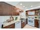 Modern kitchen featuring granite countertops, stainless steel sink, and updated appliances at 494 Owl Dr # 4, Louisville, CO 80027