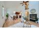 Open-concept living room with fireplace and dining area at 494 Owl Dr # 4, Louisville, CO 80027