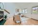 Bright living room with view of stairway and fireplace at 494 Owl Dr # 4, Louisville, CO 80027
