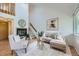 Living room with fireplace, modern decor, neutral colors, and staircase leading to the second floor at 494 Owl Dr # 4, Louisville, CO 80027