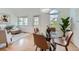 Bright living room and dining area with modern furniture and large windows at 494 Owl Dr # 4, Louisville, CO 80027