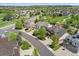 Neighborhood showing street view of the home in a Gathering-friendly suburban environment, with mature trees and well-kept lawns at 7132 S Tempe Ct, Aurora, CO 80016