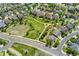 Real estate aerial view: Located near a park, the property is surrounded by green spaces and attractive neighborhood streets at 7132 S Tempe Ct, Aurora, CO 80016