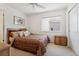 Comfortable bedroom with a window, ceiling fan, neutral carpet, and a double bed at 7132 S Tempe Ct, Aurora, CO 80016