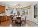 Dining area with hardwood floors and bay window overlooking the backyard at 7132 S Tempe Ct, Aurora, CO 80016