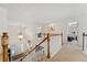 Bright and airy foyer with staircase and chandelier lighting at 7132 S Tempe Ct, Aurora, CO 80016