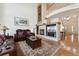 Cozy Gathering room with a fireplace, TV, and leather sofas at 7132 S Tempe Ct, Aurora, CO 80016