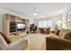 Spacious living room with ample seating and a designated work space at 7132 S Tempe Ct, Aurora, CO 80016