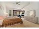 Bedroom with carpet, dresser, bed, and fireplace at 7132 S Tempe Ct, Aurora, CO 80016