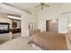 A serene main bedroom featuring a fireplace and ensuite bathroom at 7132 S Tempe Ct, Aurora, CO 80016