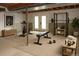 Finished basement featuring a home gym setup with exercise equipment and neutral tones at 7753 W Plymouth S Pl, Littleton, CO 80128