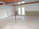 Bright unfinished basement featuring walkout access to the outdoors at 7753 W Plymouth S Pl, Littleton, CO 80128