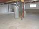 Spacious unfinished basement with exposed beams, concrete floor, and utility equipment, ready for customization at 7753 W Plymouth S Pl, Littleton, CO 80128