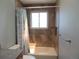 Bathroom featuring a shower-tub combination with tiled walls and a window for natural light at 7753 W Plymouth S Pl, Littleton, CO 80128