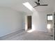 Sunlit bedroom features skylight, ceiling fan, and neutral colored carpet at 7753 W Plymouth S Pl, Littleton, CO 80128