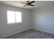 This bright bedroom offers a ceiling fan and a large window for lots of natural light at 7753 W Plymouth S Pl, Littleton, CO 80128