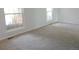 Bright bedroom with large windows and neutral carpet at 7753 W Plymouth S Pl, Littleton, CO 80128