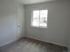 The bedroom is well-lit with a view from the window and clean carpet at 7753 W Plymouth S Pl, Littleton, CO 80128