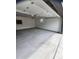This spacious garage features bright lighting, ample space, and an automatic door at 7753 W Plymouth S Pl, Littleton, CO 80128