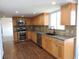 Modern kitchen boasts granite countertops, stainless steel appliances, and ample cabinet space at 7753 W Plymouth S Pl, Littleton, CO 80128