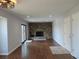 Inviting living room with a stone fireplace, wood floors, and sliding door to a backyard patio at 7753 W Plymouth S Pl, Littleton, CO 80128