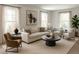 Cozy living area with large windows, comfortable seating, and contemporary decor at 7753 W Plymouth S Pl, Littleton, CO 80128