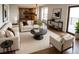 Spacious living area with comfortable seating, modern decor, and an open flow to the kitchen at 7753 W Plymouth S Pl, Littleton, CO 80128