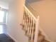 Carpeted staircase with white railing at 7753 W Plymouth S Pl, Littleton, CO 80128