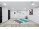 Finished basement with open workout space and storage at 6885 E Briarwood Cir, Centennial, CO 80112