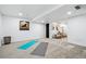 Finished basement with open workout space and storage at 6885 E Briarwood Cir, Centennial, CO 80112