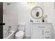 Modern bathroom with sleek vanity, updated fixtures, and tiled shower/tub at 6885 E Briarwood Cir, Centennial, CO 80112