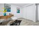 Office/bedroom features a modern desk, decor, and a sliding door closet at 6885 E Briarwood Cir, Centennial, CO 80112