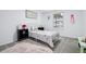 Bright bedroom features carpet, decor, and a large window for natural light at 6885 E Briarwood Cir, Centennial, CO 80112