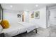 Bright bedroom with recessed lighting, neutral tones, carpet, and en-suite bathroom area at 6885 E Briarwood Cir, Centennial, CO 80112