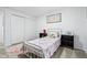 Charming bedroom features carpet, decor, and a sliding door closet at 6885 E Briarwood Cir, Centennial, CO 80112
