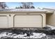Spacious two-car garage with durable siding, providing secure parking and storage at 6885 E Briarwood Cir, Centennial, CO 80112