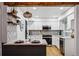 Bright kitchen boasts marble countertops, stainless steel appliances, pendant lighting, and chic decor at 6885 E Briarwood Cir, Centennial, CO 80112