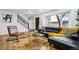 Stylish living room featuring a comfortable sofa, modern decor, and ample natural light for a welcoming ambiance at 6885 E Briarwood Cir, Centennial, CO 80112