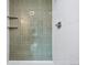 Tiled shower area with recessed shelves and modern fixtures at 6885 E Briarwood Cir, Centennial, CO 80112